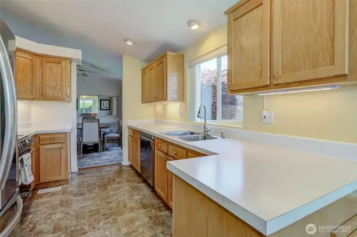 This beautiful, functional kitchen is anchored by dining space at each end. Lots of options for how you use these rooms!