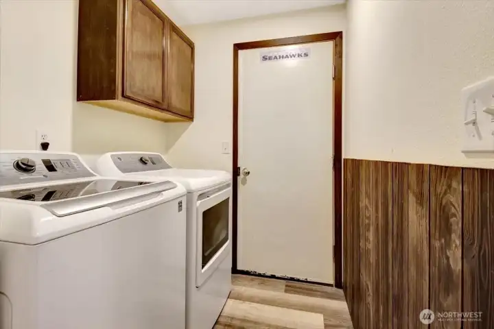 Laundry room with storage cabinets leads into the garage. Great mud-room area! Laundry room with storage cabinets leads into the garage. Great mud-room area!