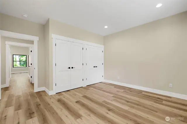 This is a look at 1 of the 3 bedrooms this custom beauty offers.  Double closet anyone??