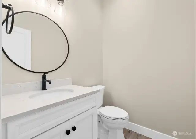 Even the guest, half bath is beautiful.  Check out the lights, vanity, mirror and hardware.