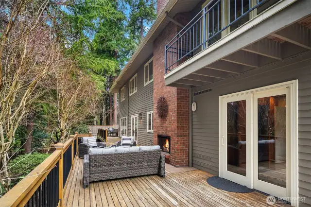 Upgraded wrap-around cedar deck with metal rails & copper post caps.