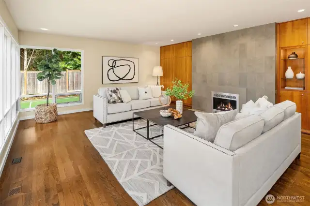 Gather around the granite-surround gas fireplace with lighted display area.