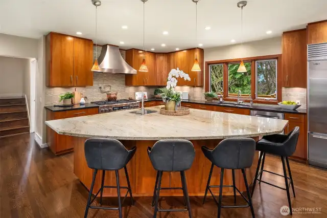 Chefs will adore this grand kitchen with massive prep/seating island.