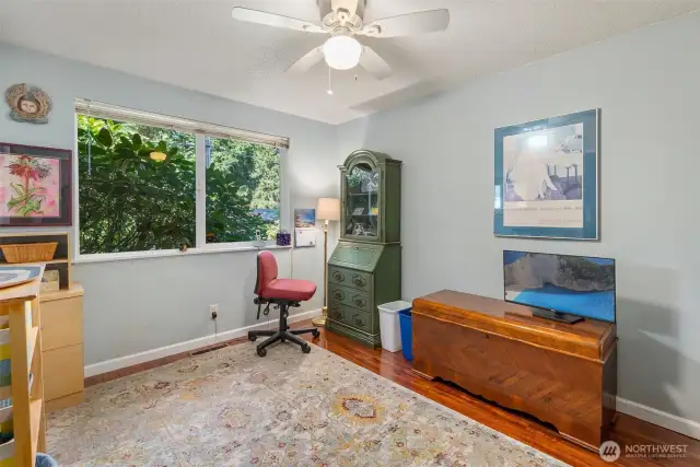 Second bedroom, facing front of home. (Third bedroom is not photographed but is virtually identical in layout to this one).