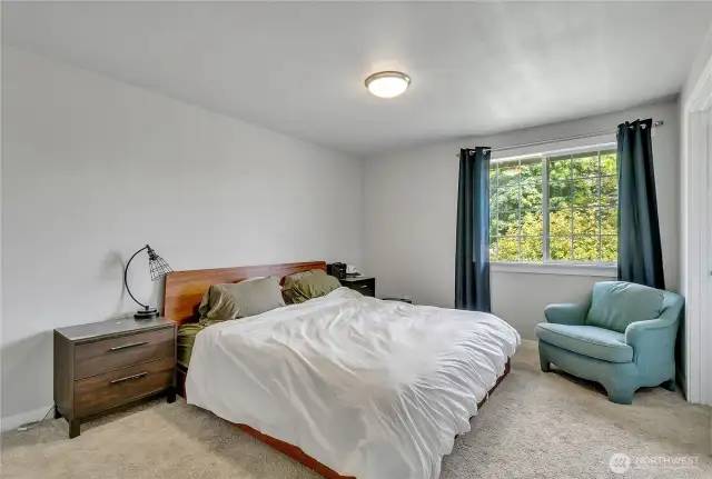 Primary bedroom features 2 his/her closets