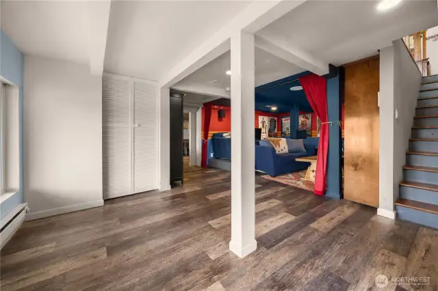 Lower level, stairs leading to basement. Shown in the photo is a utility closet.