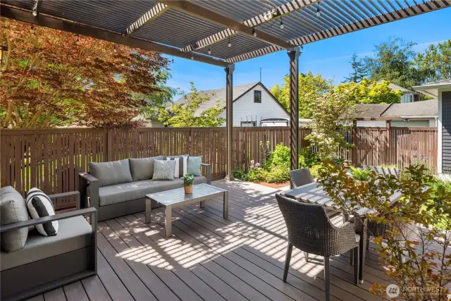 The back patio features composite decking and a StruXure motorized louvered patio cover that is remote controlled to open and close as desired.