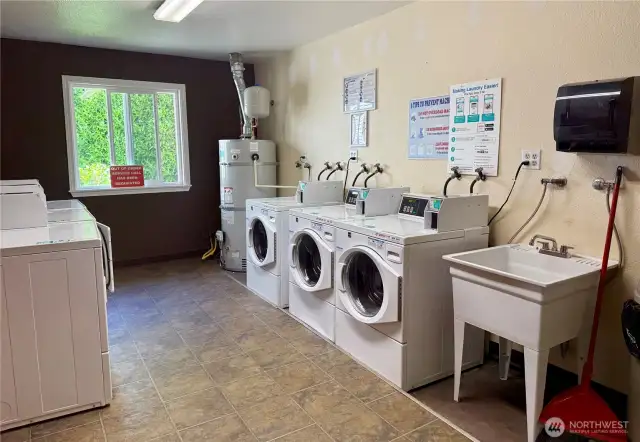Laundry room just across the parking lot.