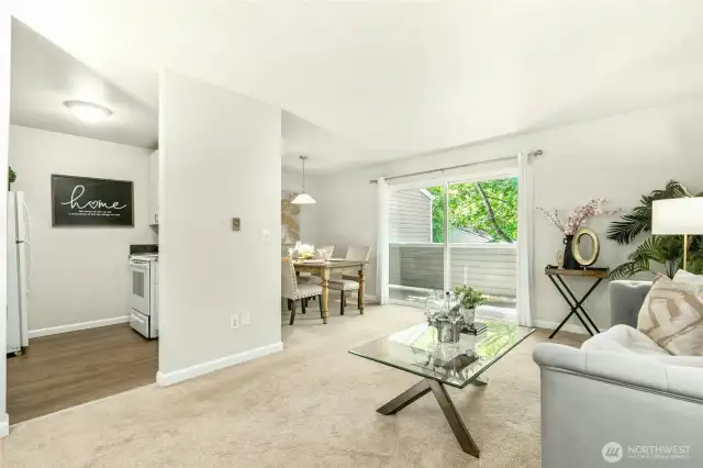 Open concept kitchen, living and dining areas.