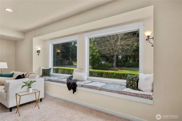 Large window and sitting area is a  great spot to unwind while reading a book, enjoying a cup of coffee.