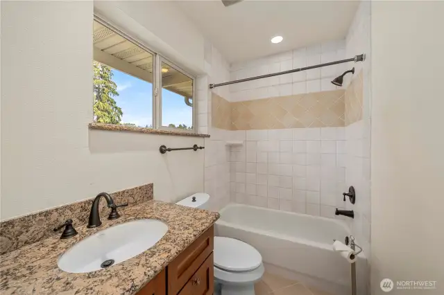 Full bathroom located on the upper level in the bonus room -