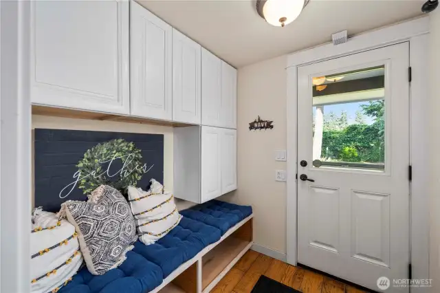 Convenient mudroom setup with additional storage and space!