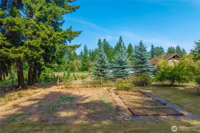 Check out the raised garden beds with water access and sprinklers.