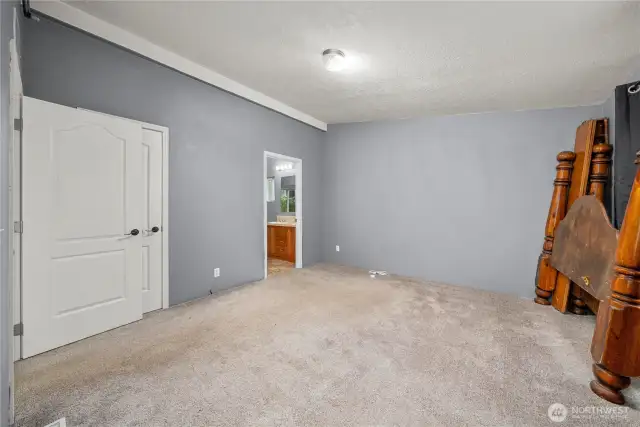 Primary bedroom includes 2 closets, one walk-in with shelves and light