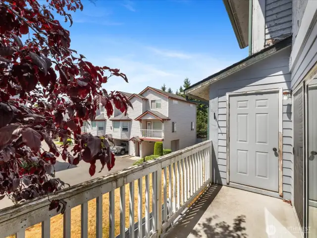 The balcony also features a convenient locked storage area for seasonal gear, tools, or extra belongings.