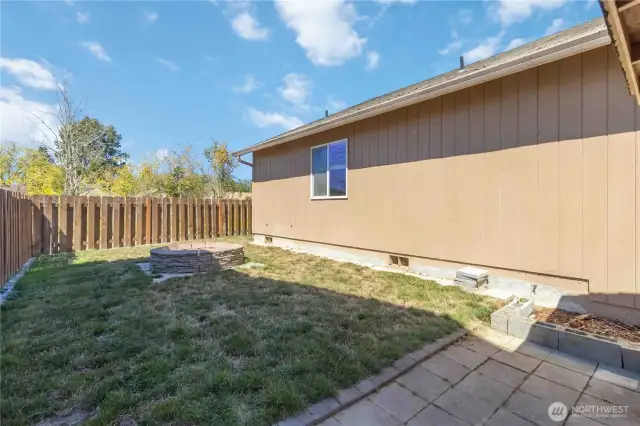Backyard Side Yard with Fire Pit and Tool Shed