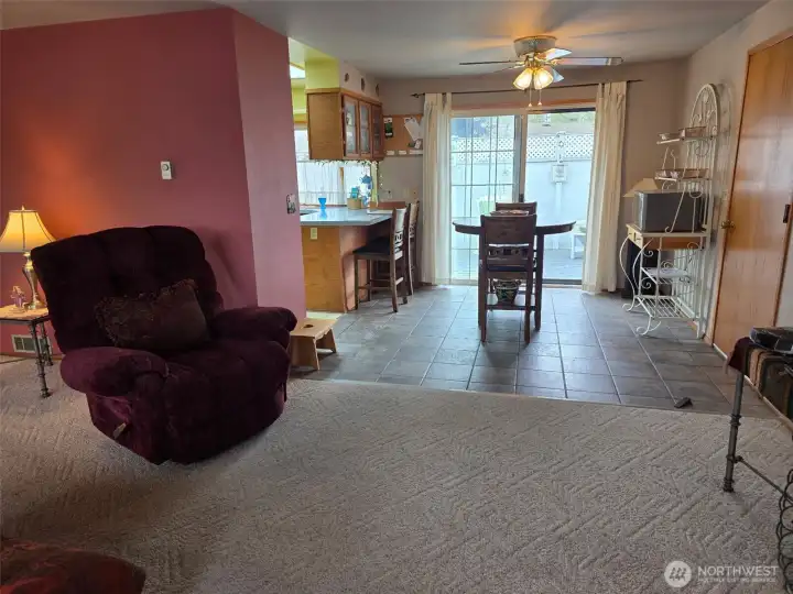 Open floor plan living room, dining room & kitchen space flow together