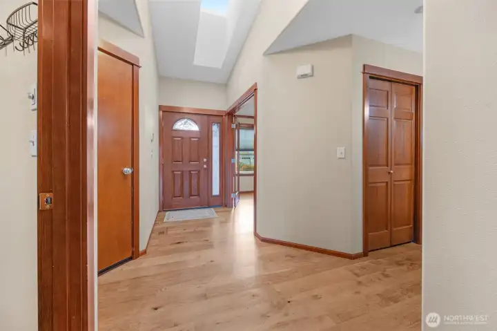Vaulted ceilings and skylights welcome you to this charming home. It boasts laminate hardwood floors throughout and a bright, open great room with vaulted ceilings, a gas fireplace, and glass doors leading to the deck.