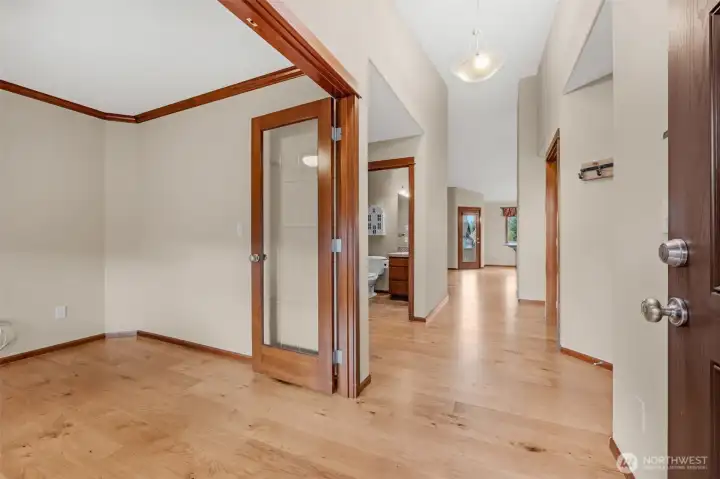 The entry hall opens into the spacious great room and kitchen.