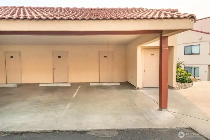 Parking space, covered and storage unit.  This is an end parking unit.