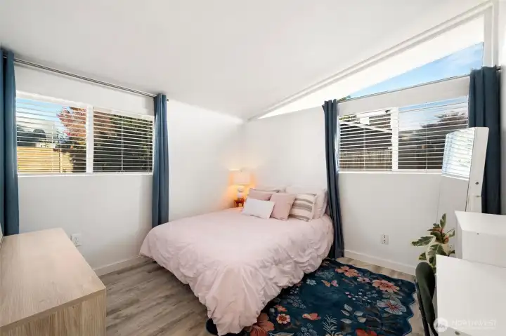 Northeast facing bedroom windows look onto the fully fenced backyard.