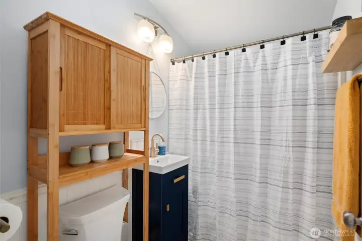Full Bath has unlimited hot water via a tankless water heater.
