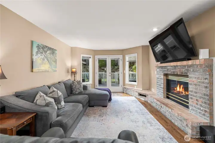 French doors continue the living space outdoors to beautiful Trex decking and concrete paver patio