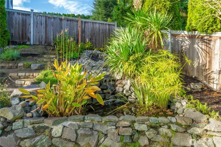 Custom-built koi pond fed by a tranquil, hand-crafted stream