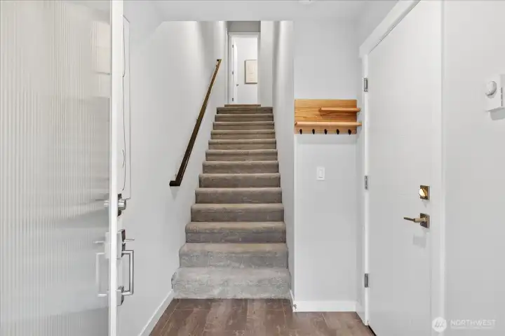 Level entry from the front door and garage, head on up the stairs to the common living areas!