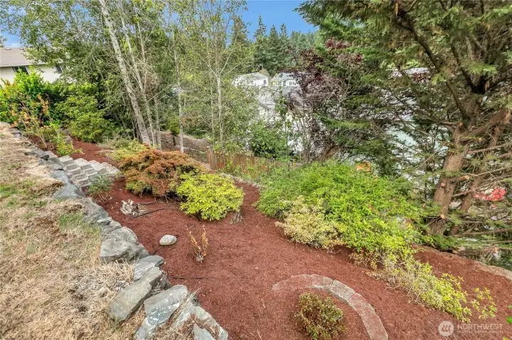 Landscaped lower lot with lilacs, azeleas and rhodys.