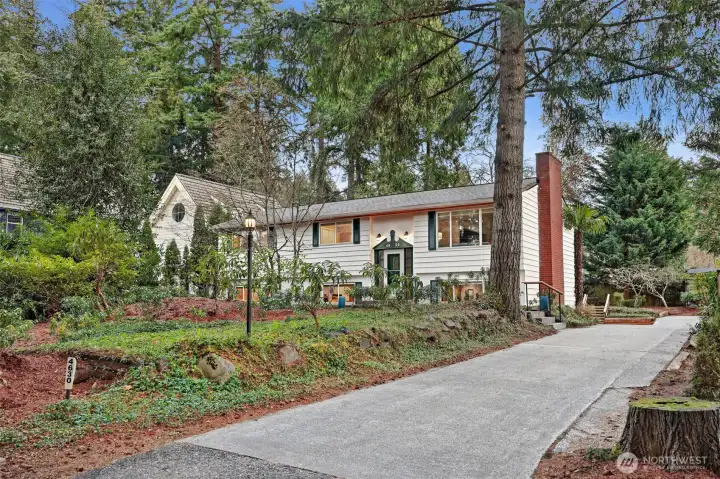 Set back from the road, the setting feels both peaceful and private.