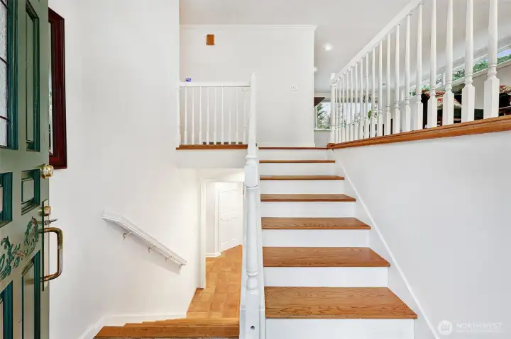 Lovely hardwood stairs lead the way up to the main level.