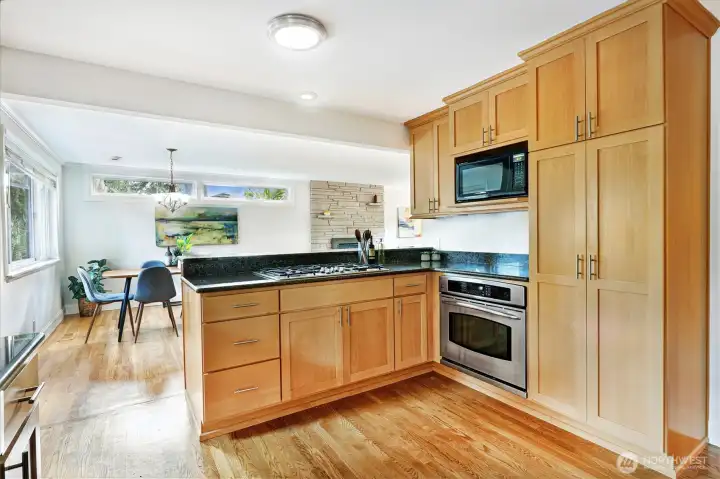 Social layout with an outward-facing cooktop so the chef can mingle.