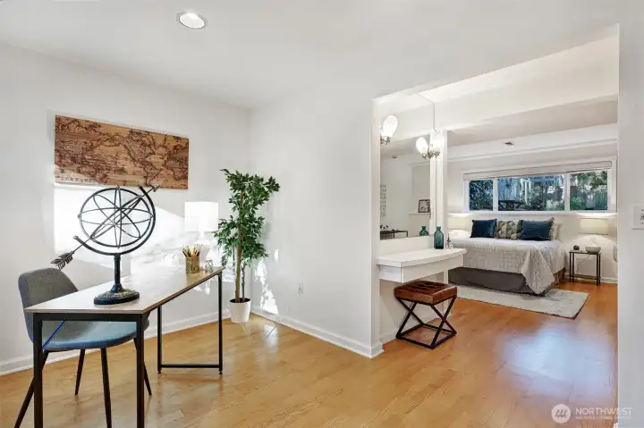Looking from the flex room toward the lower-level bedroom and vanity area.