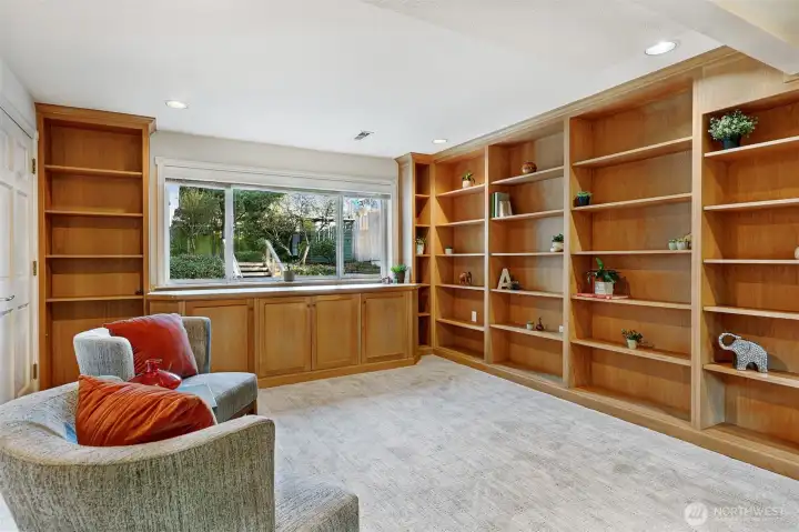 Built-in cupboards complement the shelving for even more storage.