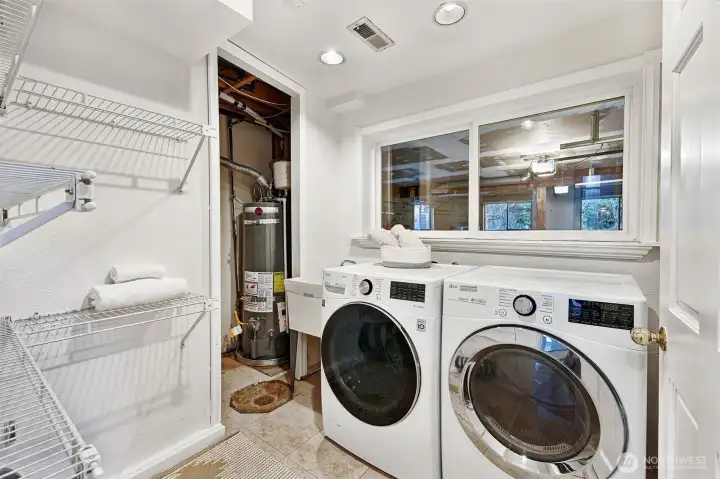 Lower-level laundry room with handy built-in shelving.