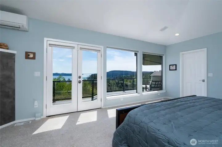 French Doors and Large windows bring in light & incredible views from the Primary