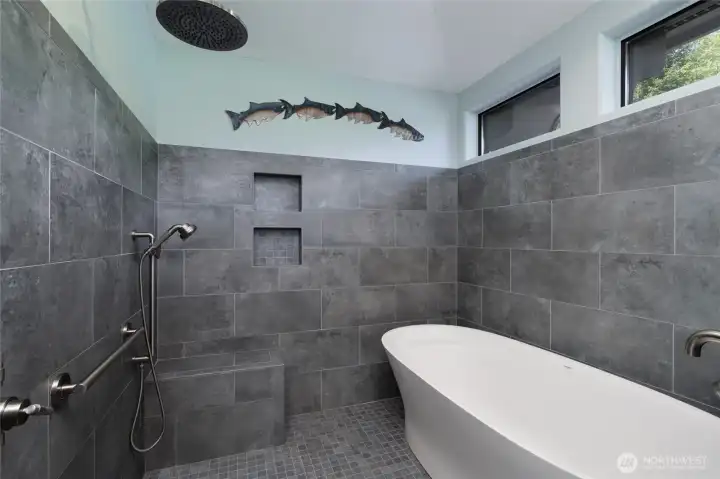 Meticulously remodeled primary shower with soaking rub