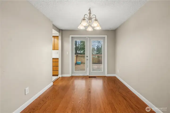 Dining room has French doors to the large back deck.
