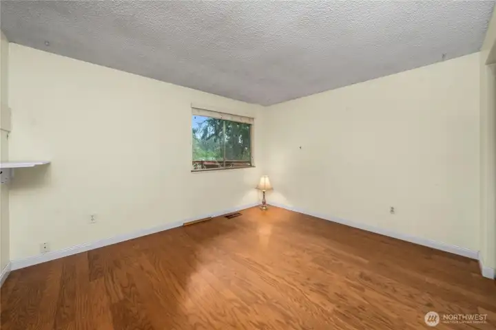 The primary bedroom includes a wall of closets and separate door to the hall bathroom.