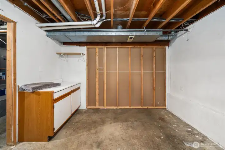 Another bonus room on the lower level, just past the utility room, heading toward the garage.