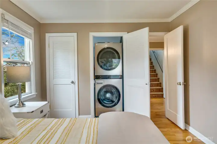 Dual closets add flexibility, including one with a stacked LG washer and dryer (both new in 2023)—bringing convenient main-floor laundry into everyday living.