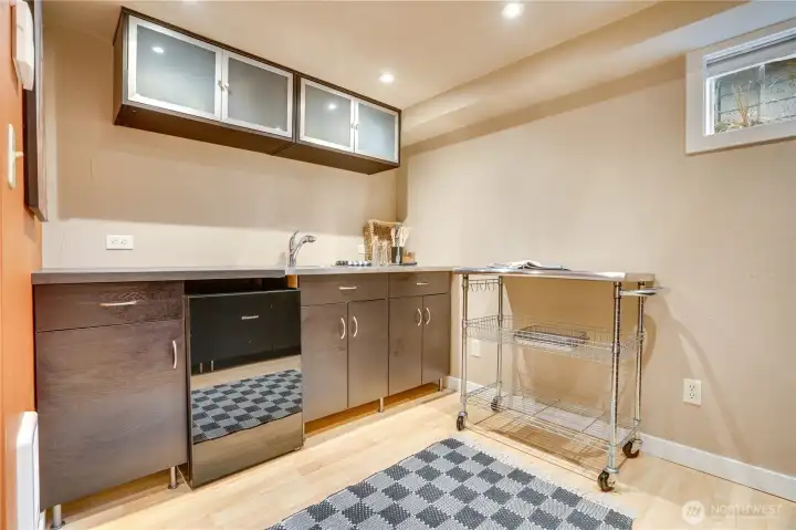 A spacious kitchenette with generous cabinetry and counter space supports independent living with ease.