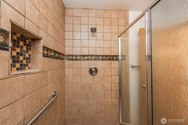 tile shower in primary bathroom