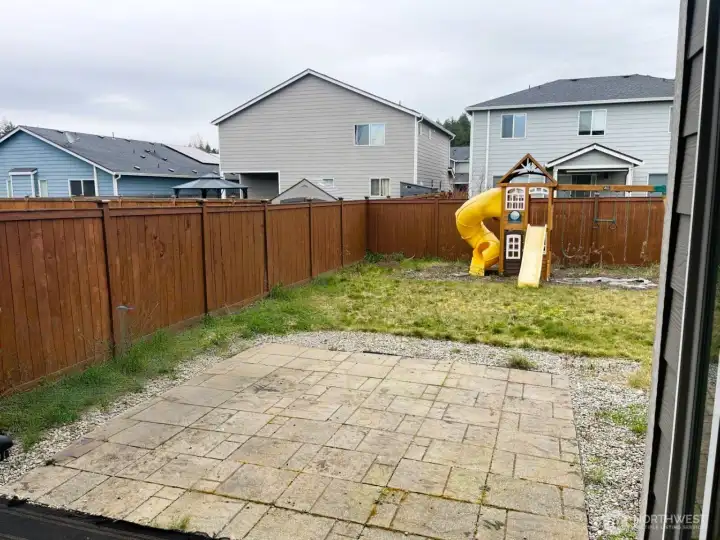 Unwind in the spacious backyard featuring an extended patio—ideal for entertaining and a charming playhouse for the little ones! Fully fenced with ample room for outdoor activities.
