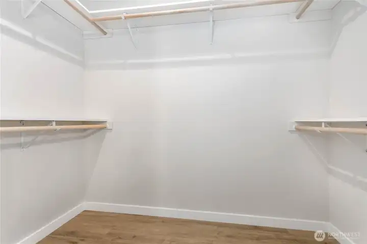 Walk-in closet with nice shelving.
