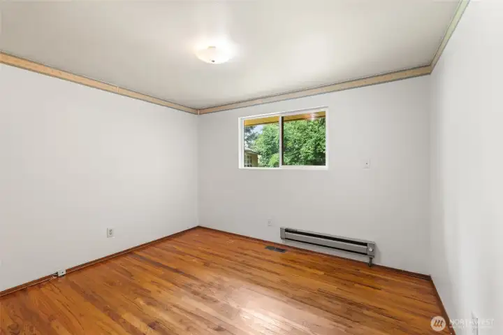 Spacious primary bedroom offers a peaceful retreat at the end of the day.