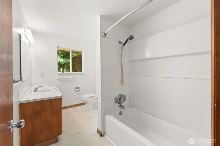 Bright bathroom with the opportunity to update to your own style.