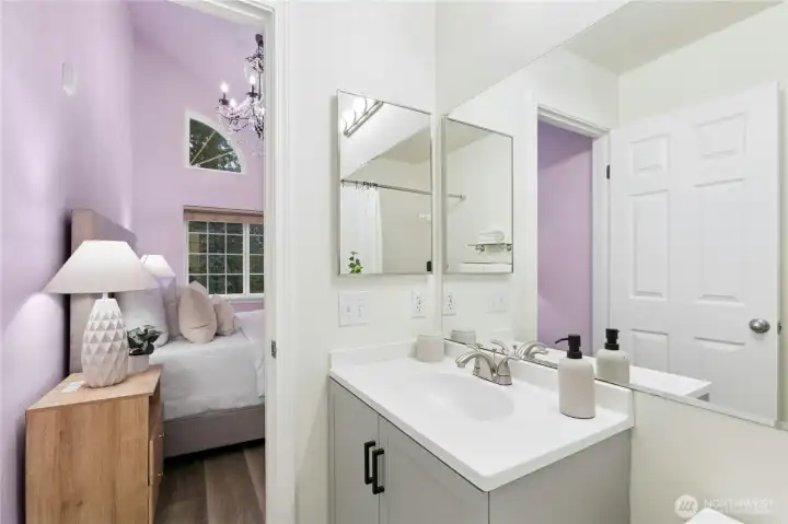 Ensuite bath connected to primary for maximum convenience and privacy. Purple walls have been painted white. Ensuite bath connected to primary for maximum convenience and privacy. Purple walls have been painted white.