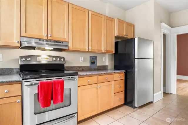 Kitchen.  Tons of storage, Stainless Steel appliances and Granite Countertops